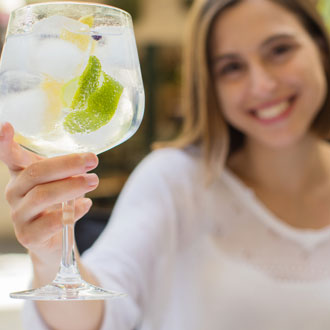 Woman with a gin and tonic