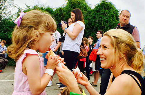 A girl and mum try food at Cowbridge Food Festival
